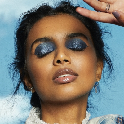 Model Kyle wearing Liquid Glitter Eyeshadow in Bling Bling (83447)  and in Black Magic (83444) and Putty Eye Primer in white (84871) and black (84876) for Play Harder look.