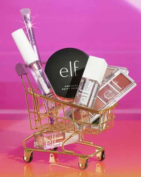 Still life of Lip Lacquer in Clear (22181), Liquid Glitter Eyeshadow in Disco Queen (83440), Poreless Putty Primer (85912), Bite Size Eyeshadow in Berry Bad (29922) and Rose Water (59924) in Golden Cart -
